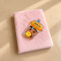 Pink plush notebook with Bubble Tea charm on the cover