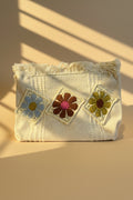 Crochet Granny Square Clutch Bag – cream woven cotton pouch with 3 crochet flower patches in blue, brown-pink and olive green, with fringe trim